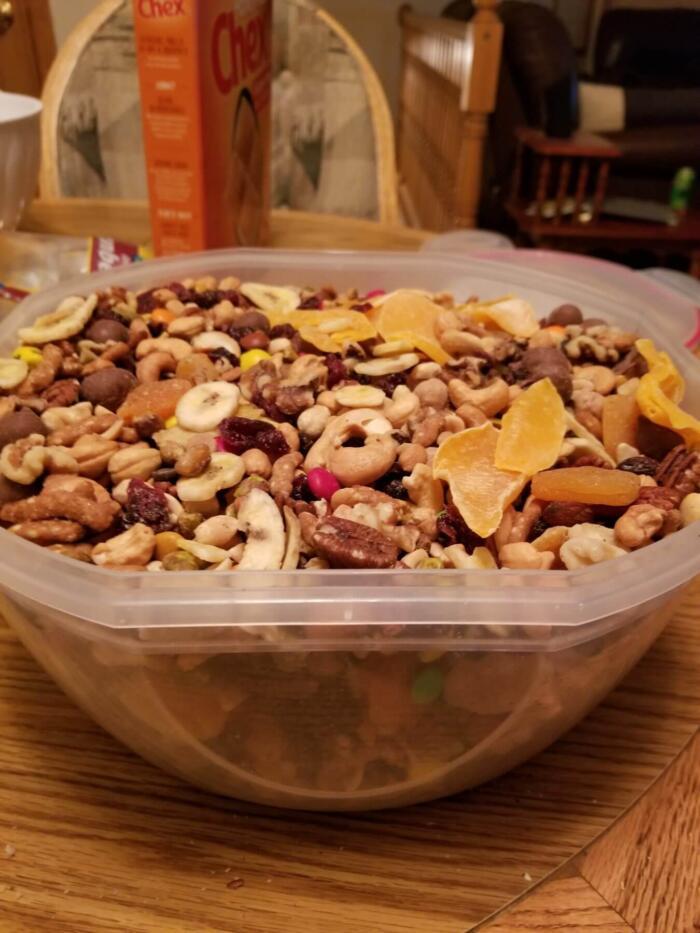 There is a lot of great value trail mix in homemade recipes. I have no idea how many calories are in this trail mix recipe since I bought most of it in bulk. Bulk trail mix nutrition is not my specialty. All I care about is flavor. I made this recipe on the fly. Wanted trail mix bar to munch on, but didn't want to make trail mix bars. So I stopped by the local grocery store. Bought bulk mountain trail mix ingredients, a dried mangos, apricots, cranberries, banana chips, chex cereal & peanut indulgent trail mix to create this camping food. And stored it in an 8 quart tupperware bowl that had a clasping lid. This trail mix recipe lasted 3 weeks.