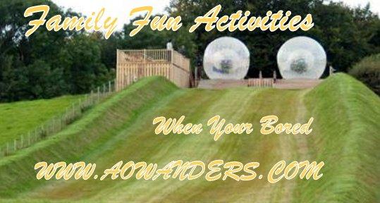 Two zorbing balls waiting at the top of the holl to roll down with participants. When your bored and looking for a good time you gotta try zorbing!!